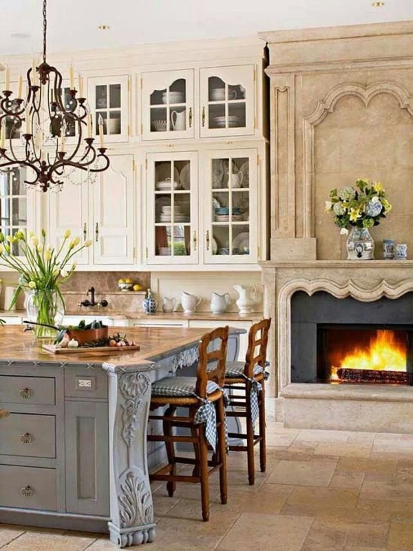 Such a gorgeous fireplace! I would love this kitchen and a cook to go ...
