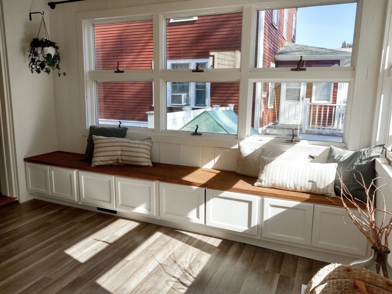 Sunlit Living Room Bench with Storage and Cushions