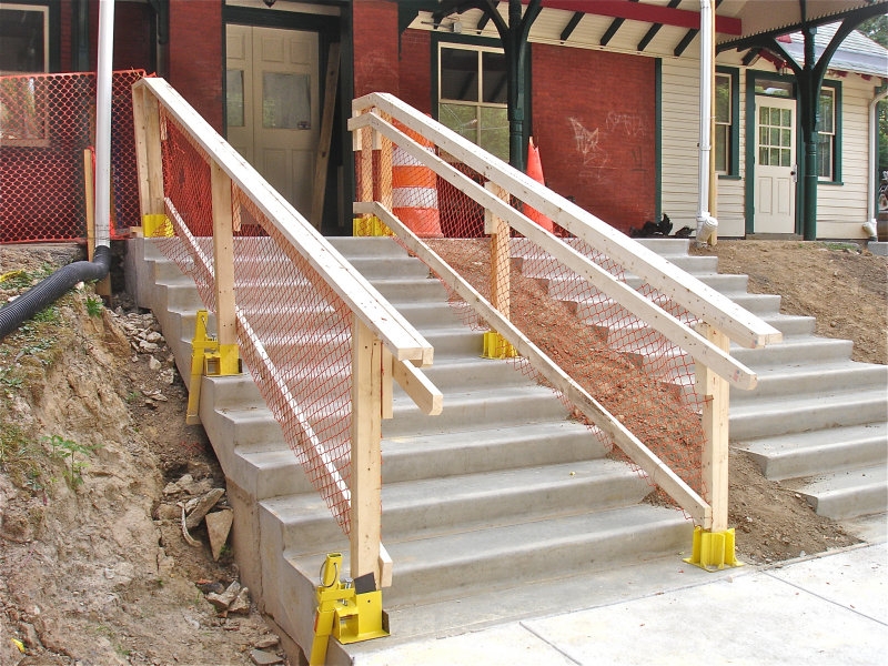 Temporary Wooden Railing on Outdoor Concrete Stairs