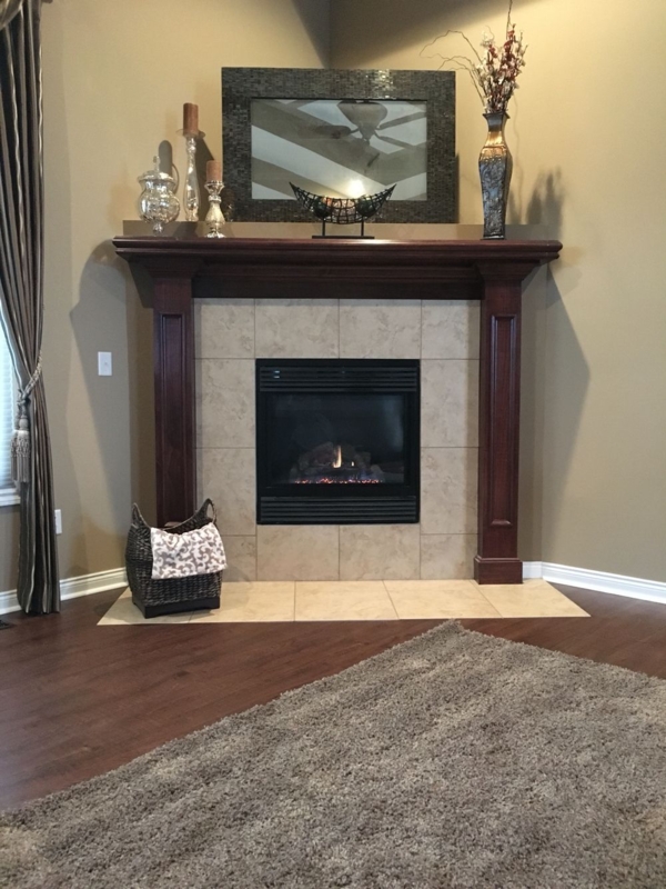 Traditional Corner Fireplace Mantel with Elegant Decor