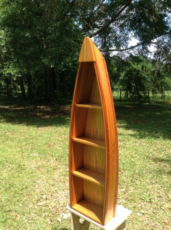 Unique Canoe-Shaped Wooden Bookshelf Design