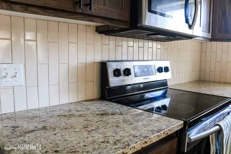 Vertical Beige Subway Tile Kitchen Backsplash Design