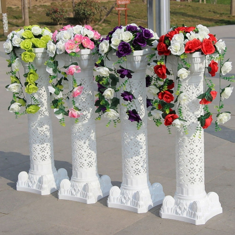 White Plastic Roman Pillar Stands with Floral Arrangements
