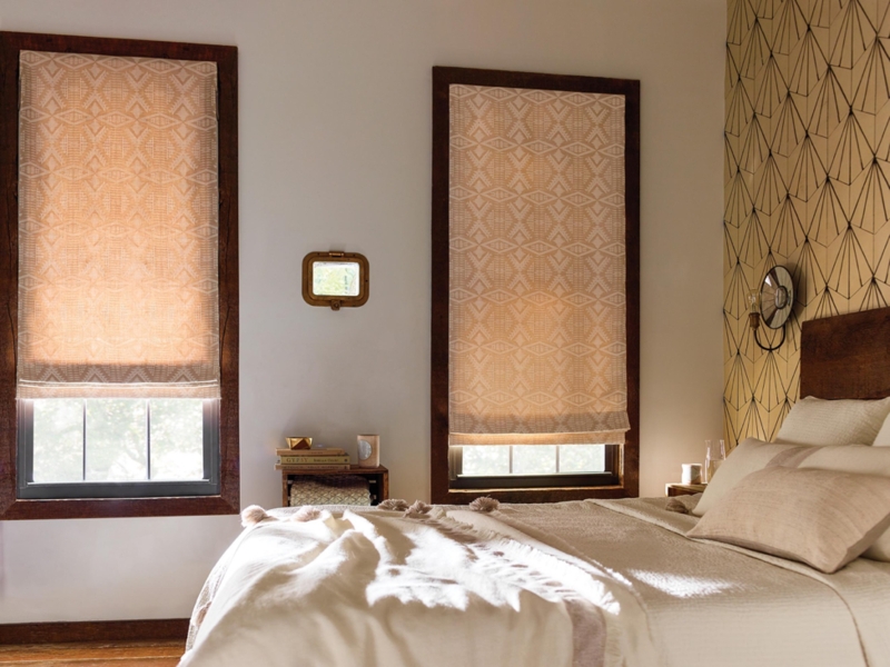 Cozy Bedroom with Patterned Roman Shades