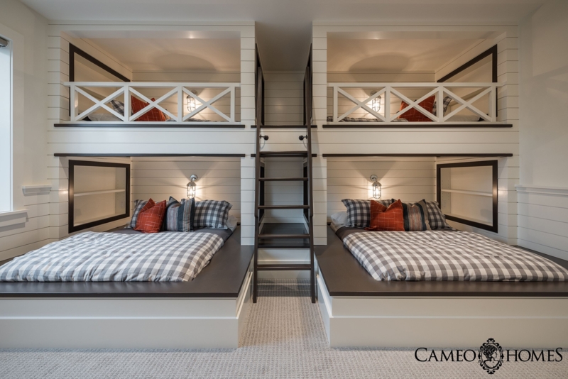 Cozy Bunk Room with Built-In Beds and Ladder