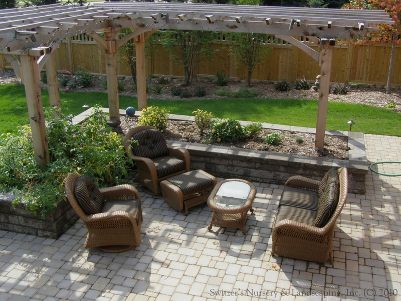 Cozy L-Shaped Pergola with Wicker Patio Furniture