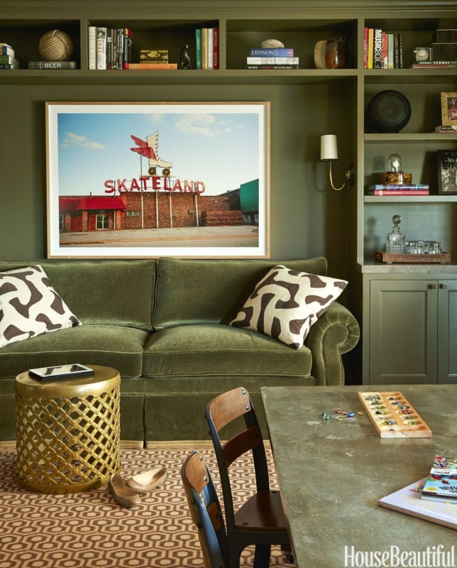 Cozy Living Room with Moss Green Sofa and Shelves