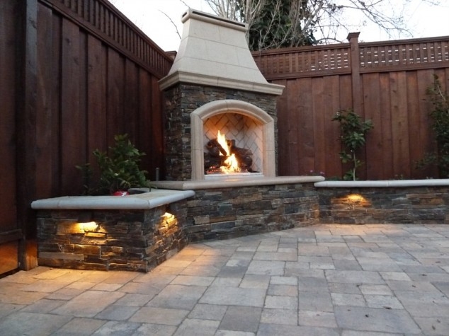 Cozy Outdoor Corner Fireplace with Stone Seating