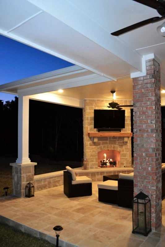 Cozy Outdoor Living Area with Fireplace and TV