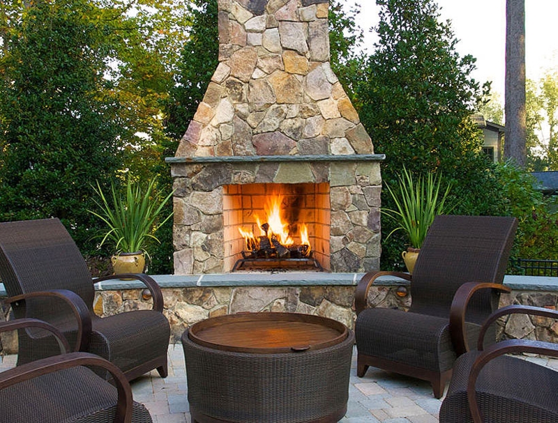 Cozy Stone Outdoor Fireplace Seating Area