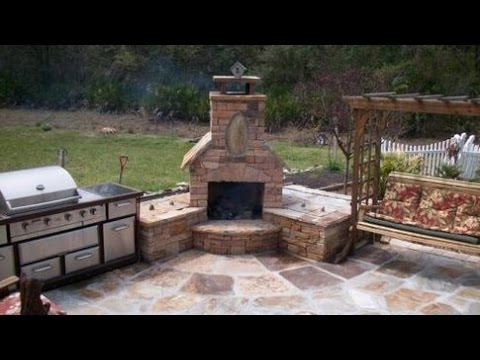 Cozy Stone Patio Corner Fireplace with Outdoor Kitchen