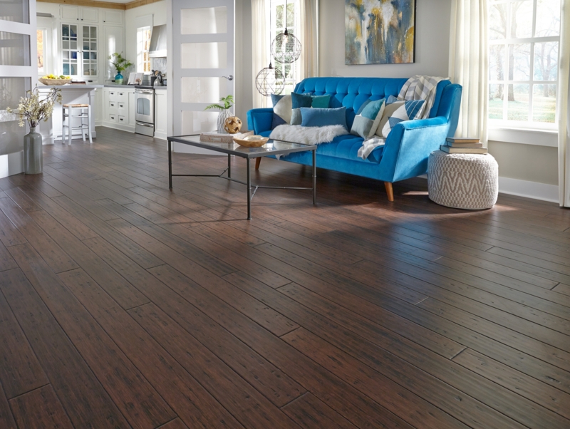 Elegant Dark Bamboo Flooring with Blue Velvet Sofa