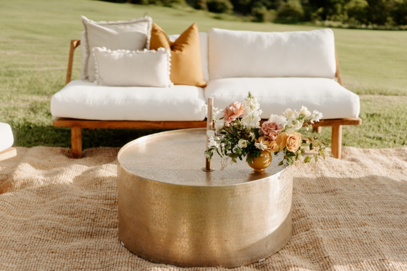 Elegant Gold Drum Coffee Table with Floral Arrangement