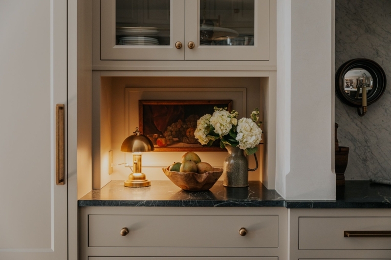 Elegant Kitchen Countertop with Brass Lamp and Decor