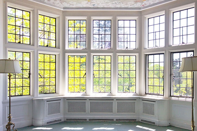 Elegant Lattice Windows with Classic White Frames