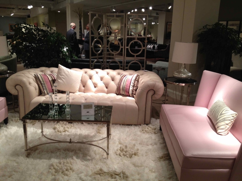 Elegant Pink and Beige Leather Sofas with Plush Rug