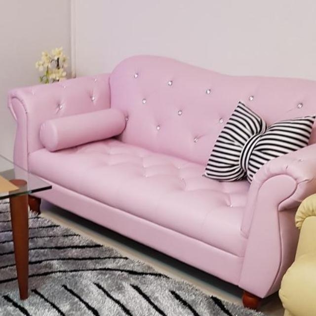 Elegant Pink Leather Sofa with Decorative Pillows