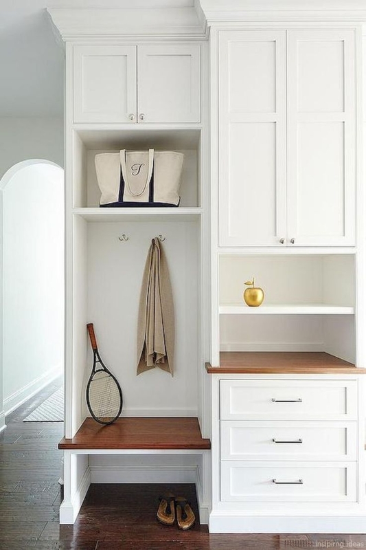 Elegant White Mudroom Entryway with Wooden Accents