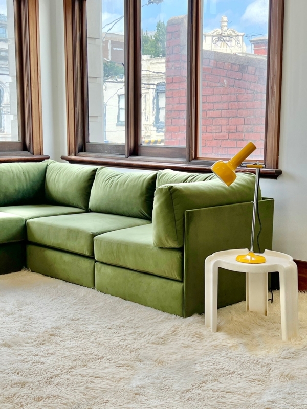 Green Modular Sofa with Cozy White Rug