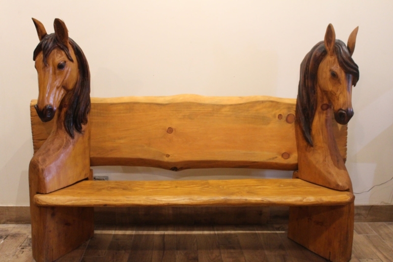 Hand-Carved Wooden Horse Bench with Rustic Charm