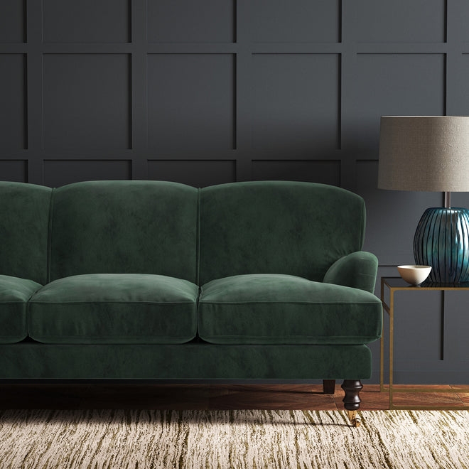 Hunter Green Velvet Sofa with Dark Paneled Wall
