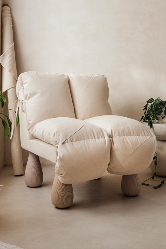 Minimalist Beige Nap Chair with Sculptural Wooden Legs