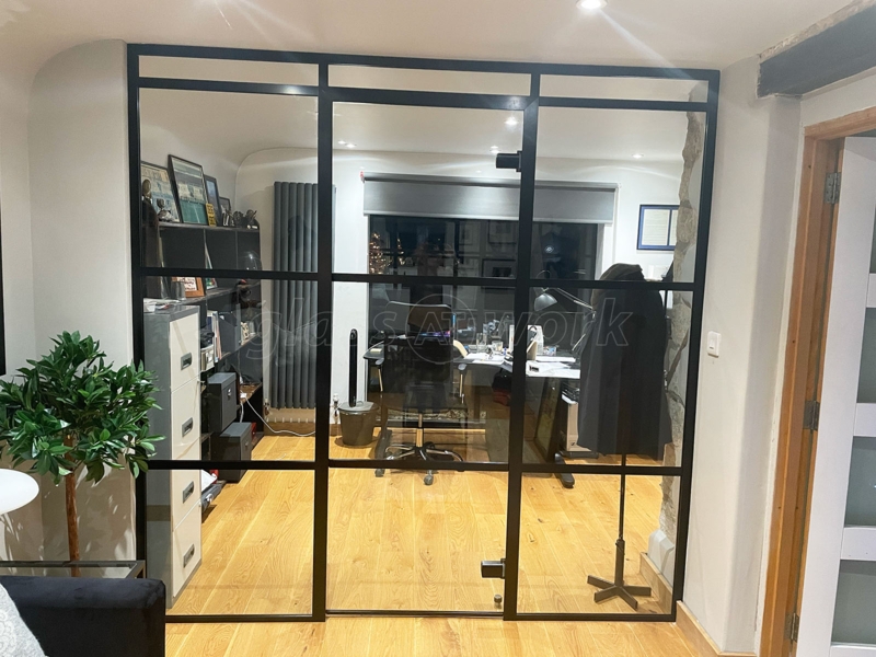 Modern Glass Partitions with Black Frames in Home Office