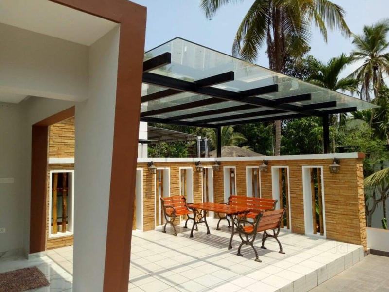 Modern Pergola with Glass Roofing and Outdoor Seating