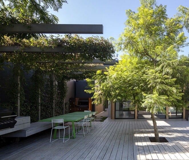 Modern Steel L-Shaped Pergola with Greenery