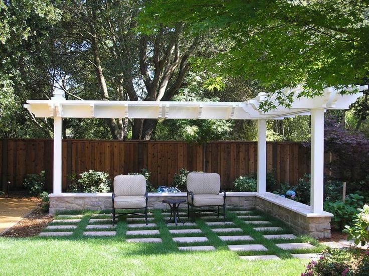 Modern White L-Shaped Pergola with Stone Bench