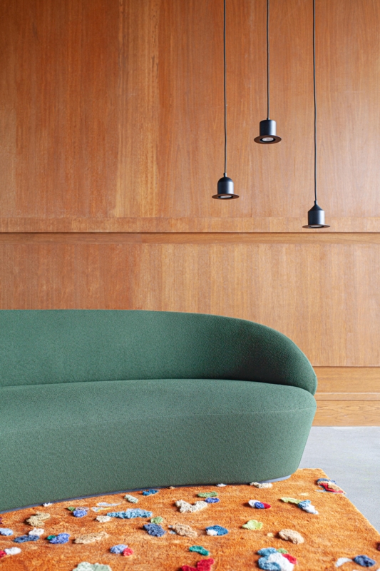 Moss Green Nave Sofa with Minimalist Pendant Lights
