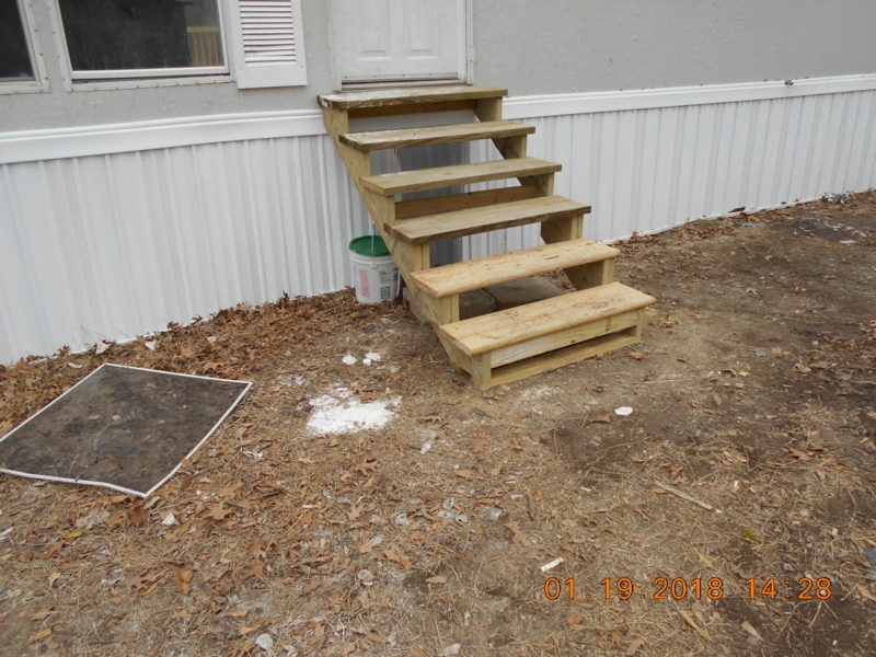 Simple Wooden Steps Leading to Side Door