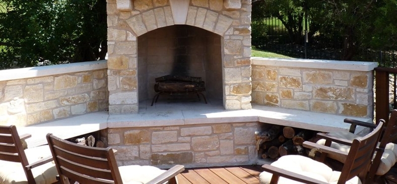 Stone Corner Outdoor Fireplace with Seating Area