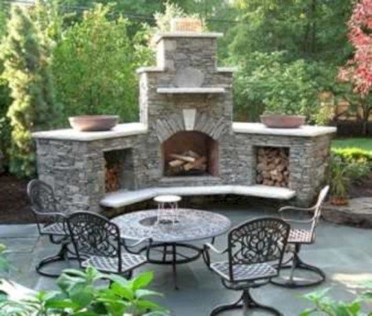 Stone Outdoor Fireplace with Curved Seating Patio