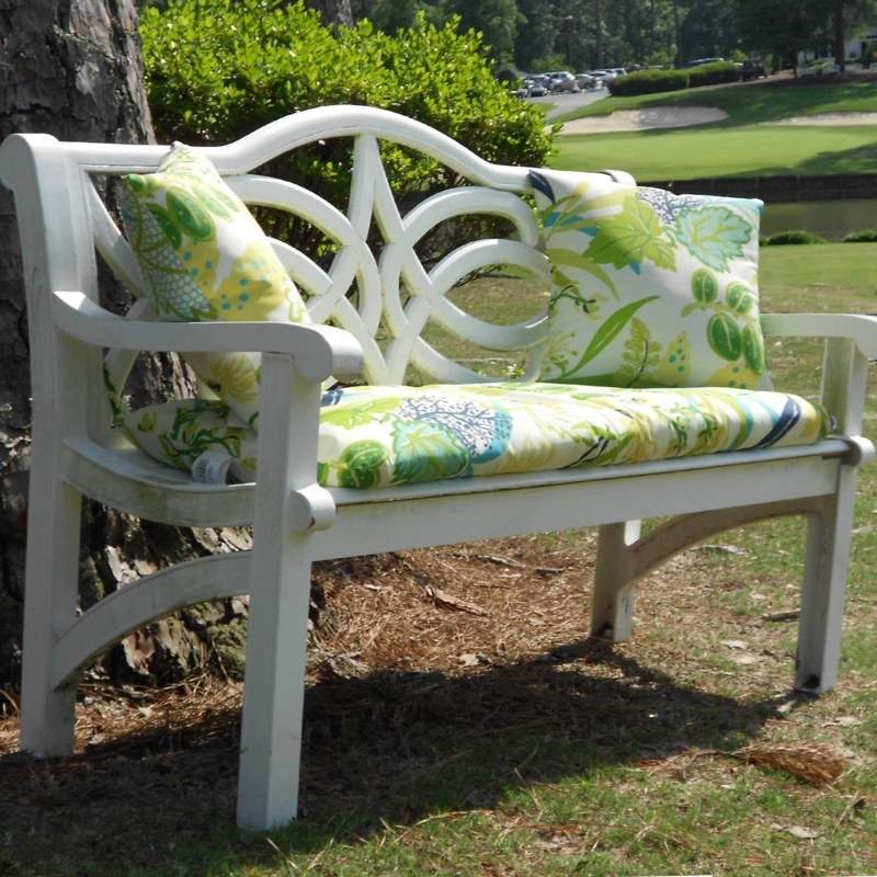 White Outdoor Bench with Colorful Cushions and Pillows