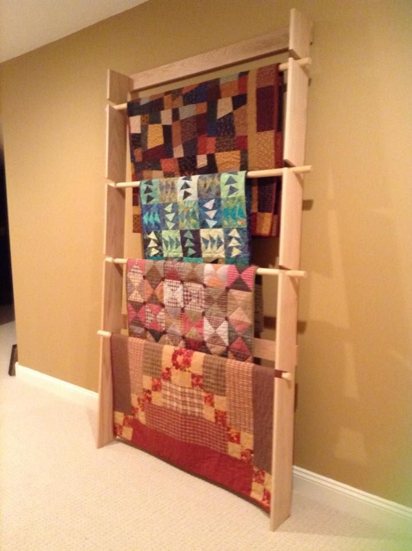 Wooden Quilt Rack Displaying Colorful Quilts