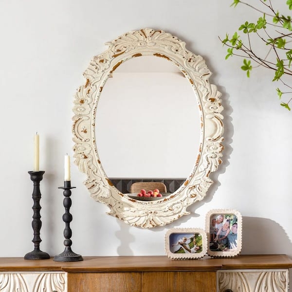 Antiqued White Oval Mirror with Baroque Scrollwork Frame