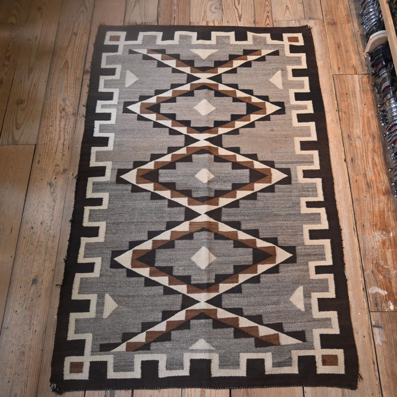 Area Rug featuring Charcoal Brown Stepped Border and Diamond Motif