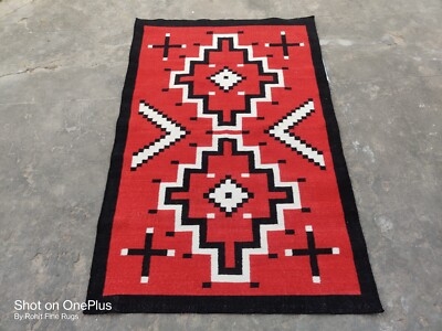 Area Rug in Cherry Red featuring Stepped Diamond and Chevron Accents