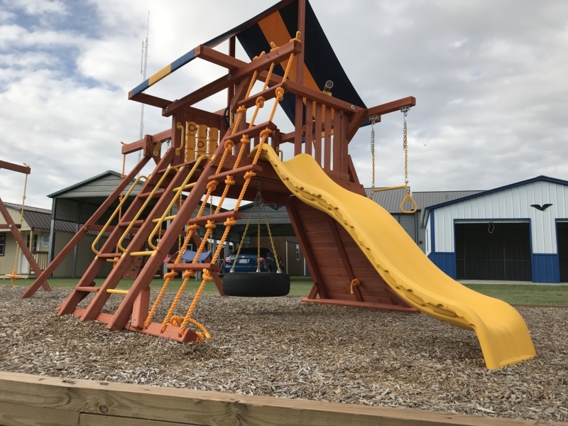 Backyard Playset Adventure Style with Central Tire Swing