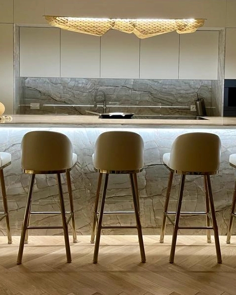 Bar Stools with Slim Gold Legs and Curved Beige Upholstered Seat