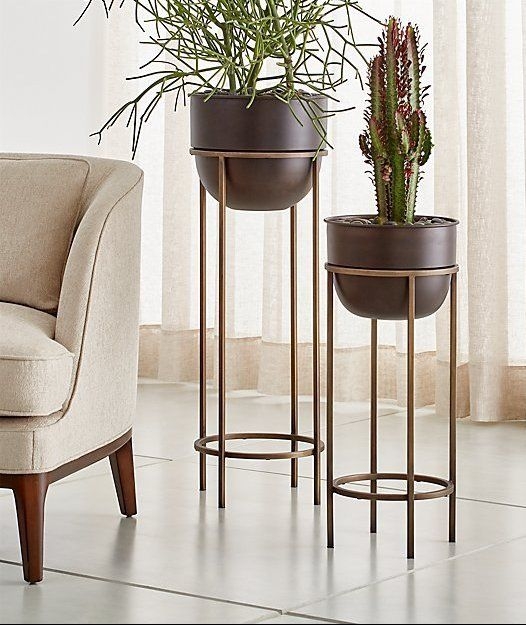 Bronze Tiered Plant Stands with Circular Base Rings and Slim Legs.