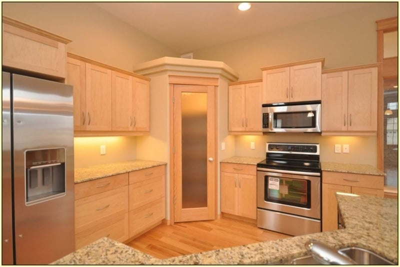 Built-In Corner Pantry with Frosted Glass Door and Light Oak Finish
