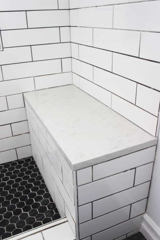 Built-In Shower Bench with Stone Slab Top and Hexagon Tile