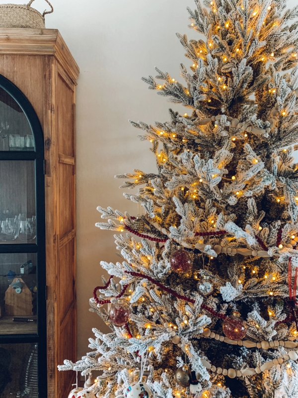Christmas Tree: Flocked, Natural Bead Garland, Arched Wood Cabinet