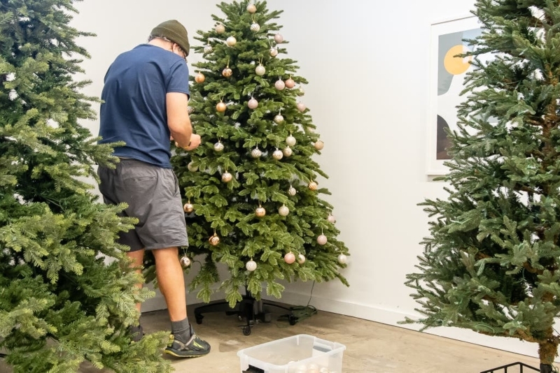 Christmas Tree with Rolling Stand in Minimalist Holiday Setup