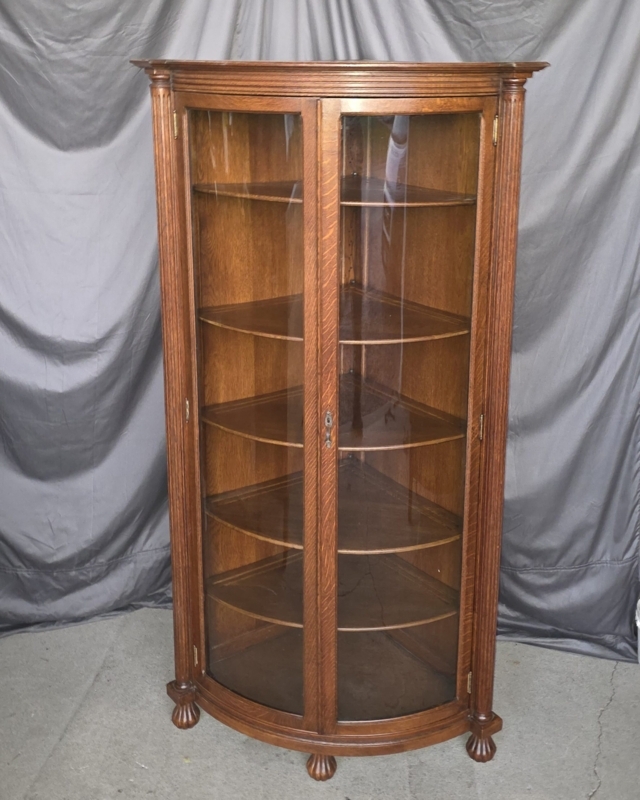 Corner Cabinet featuring Curved Glass and Claw Feet Details