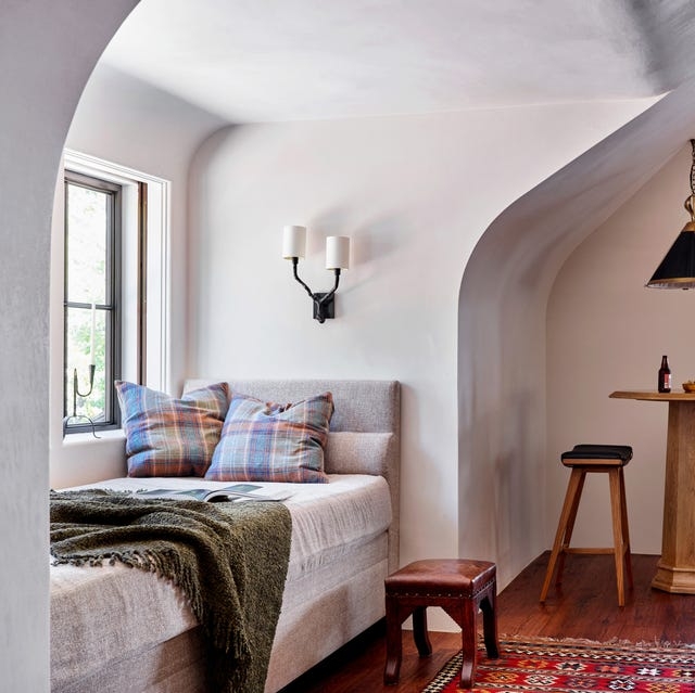 Daybed in Arched Alcove with Plaid Textile, Rustic Reading Corner