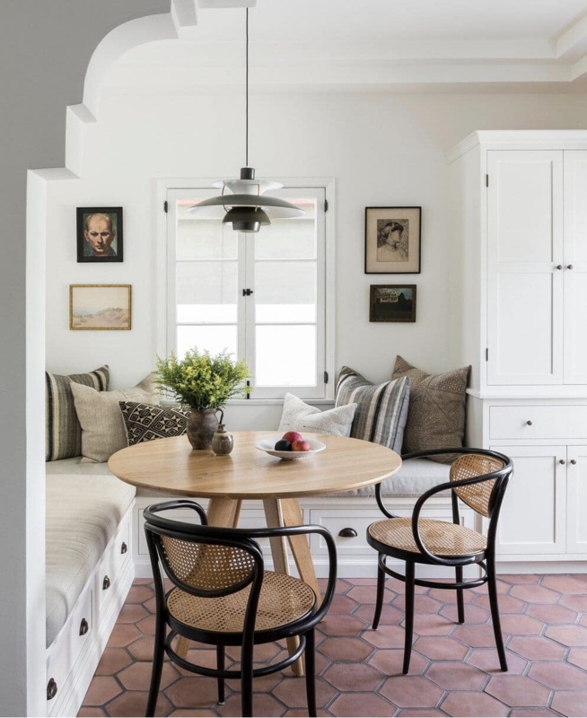 Dining Nook with Hexagonal Terracotta Tiles and Black Cane Chairs