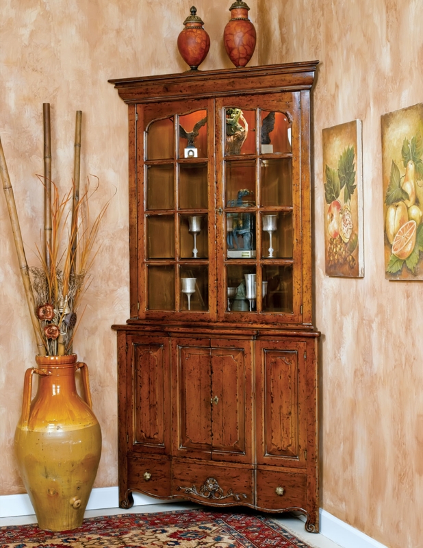 Distressed Wood Corner Cabinet with Arched Mullions and Carved Apron